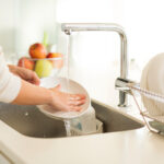 Housewife,Washing,Dishes,In,The,Kitchen,Sink